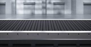 An industrial conveyor belt system in a factory, transporting items through various stages of production.